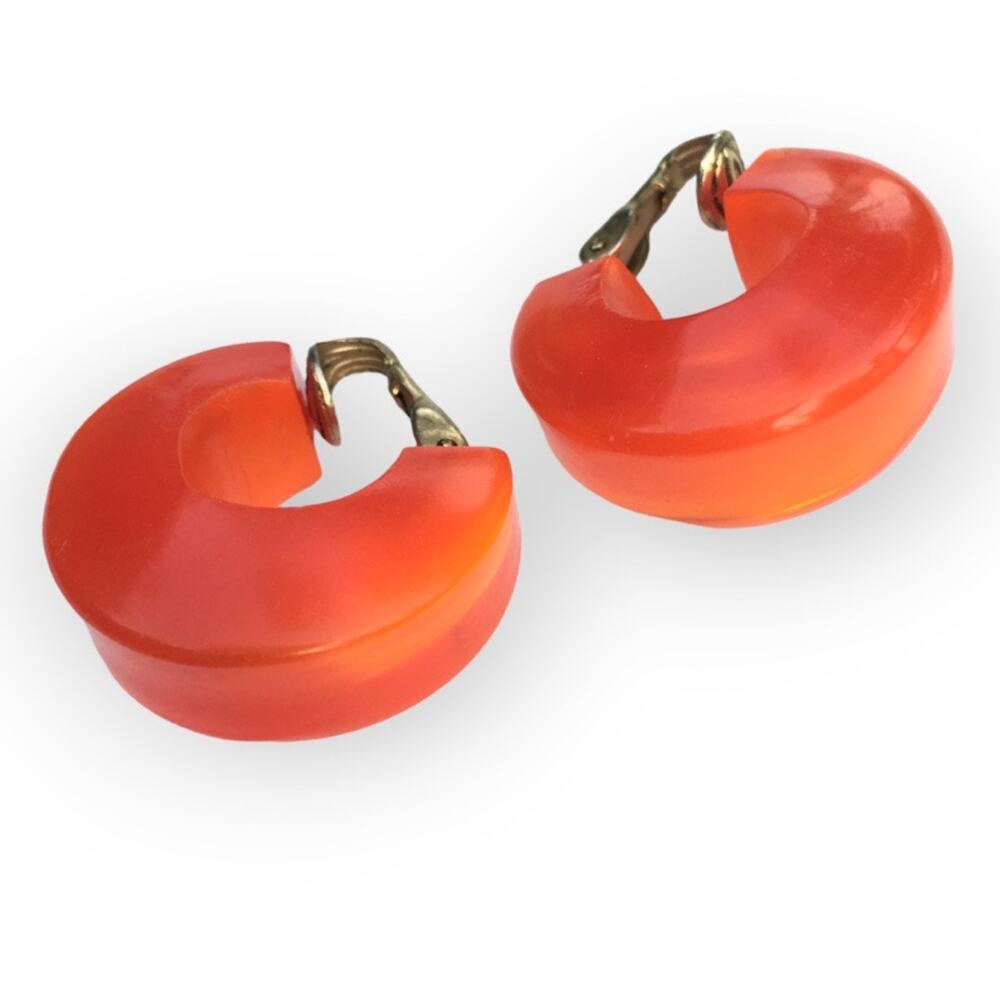 Hong Kong stamped lustrous bright orange iridescent swirl clip on earrings